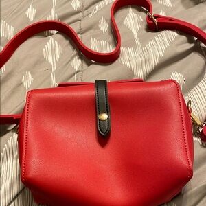 Melie Bianco Red and Black Crossbody Bag with Sleek Design